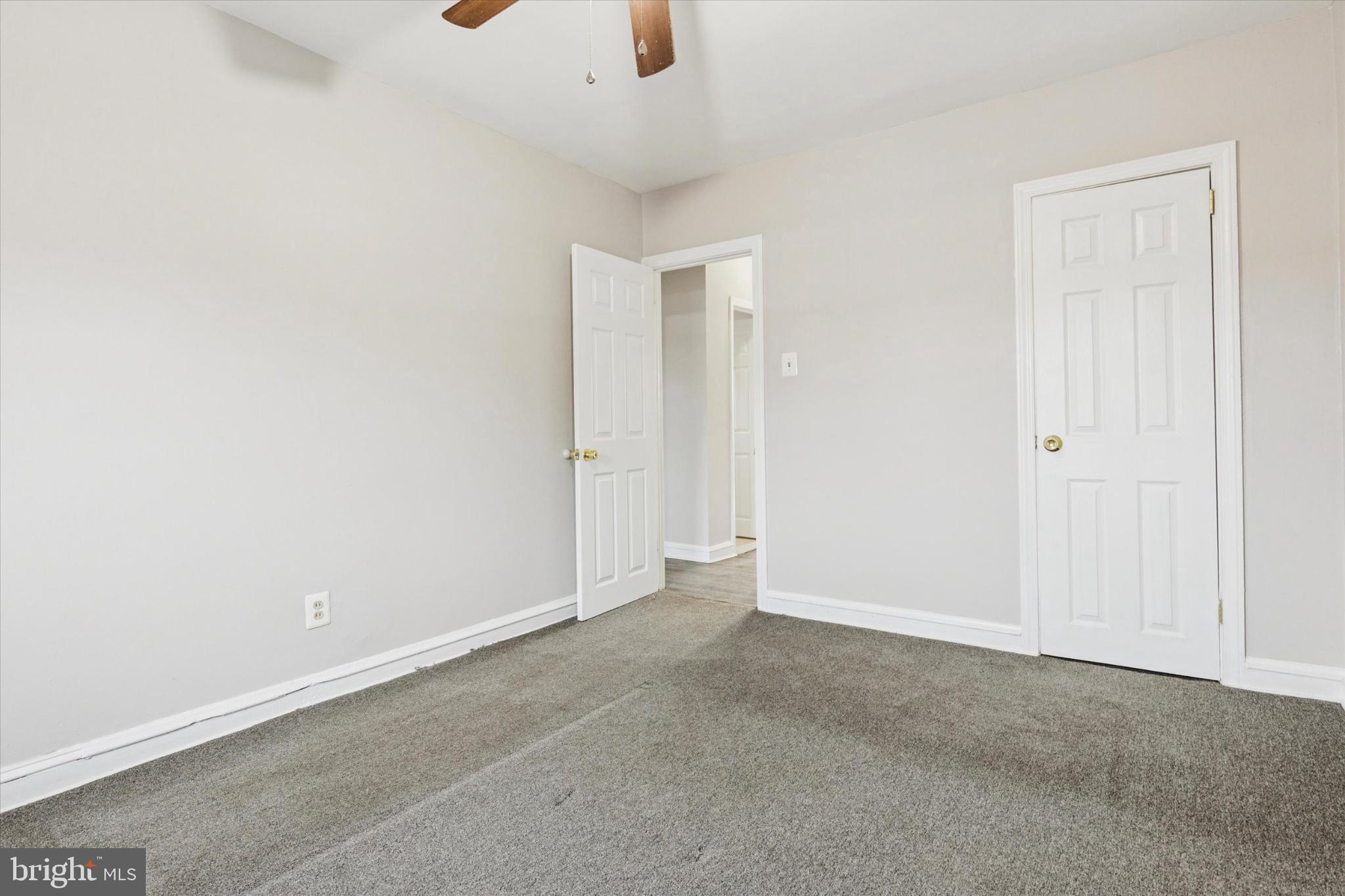 2415 80th Avenue Philadelphia, PA 19150 - Photo 22 of 35 an empty room with an entryway and fan