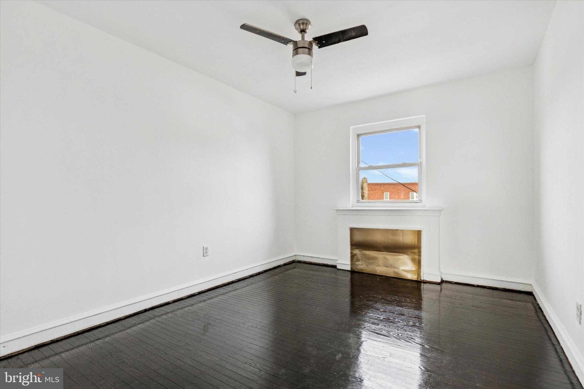 2415 80th Avenue Philadelphia, PA 19150 - Photo 26 of 35 an empty room with a piano and wooden floor