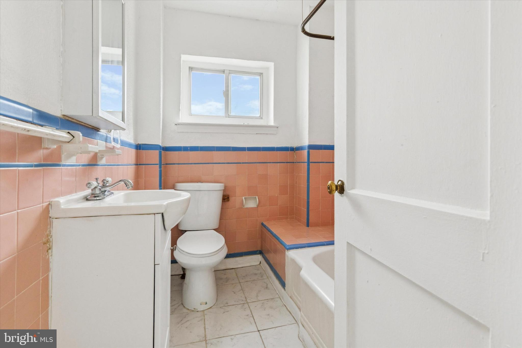 2415 80th Avenue Philadelphia, PA 19150 - Photo 30 of 35 a bathroom with a sink toilet and a mirror