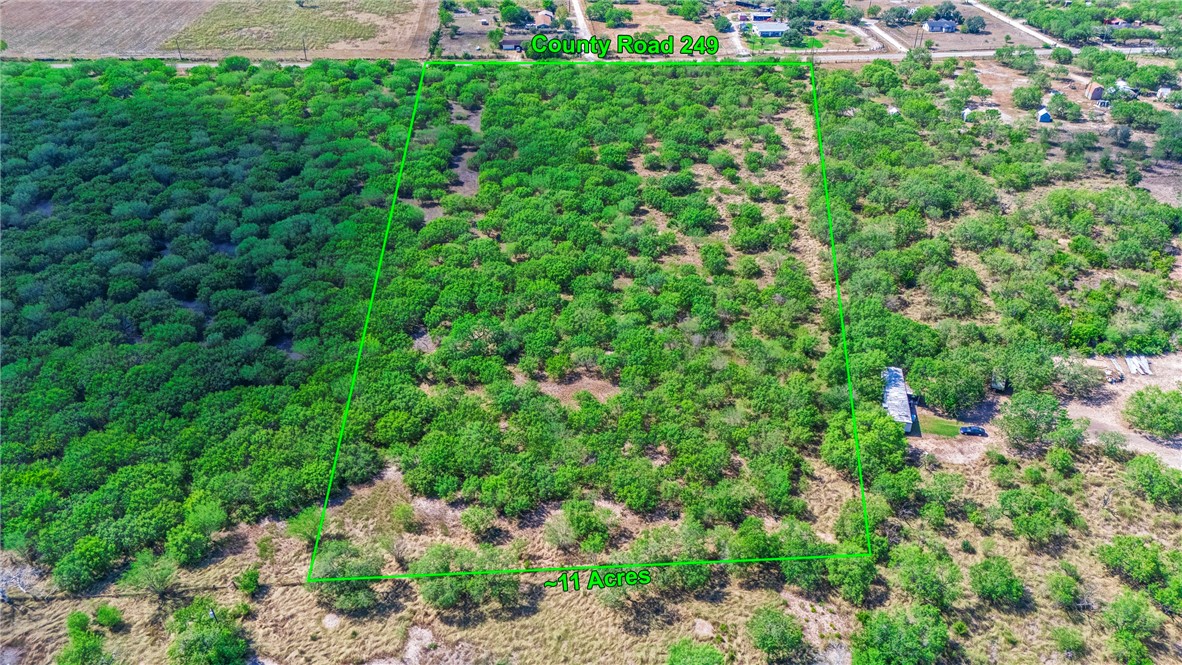 24940 County Road 249 Mathis, TX 78368 - Photo 6 of 14 an aerial view of residential house with outdoor space and trees all around
