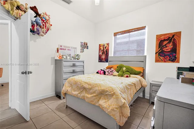 a bedroom with a bed and a cabinets