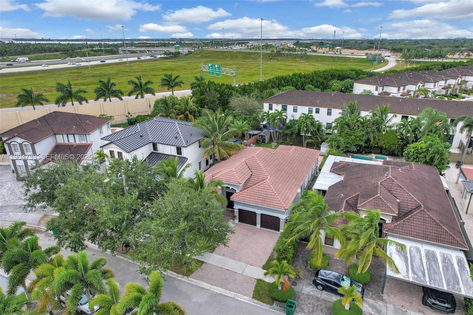 9067 Northwest 182nd Terrace Hialeah, FL 33018 - Photo 2 of 40 an aerial view of a house with a lake view
