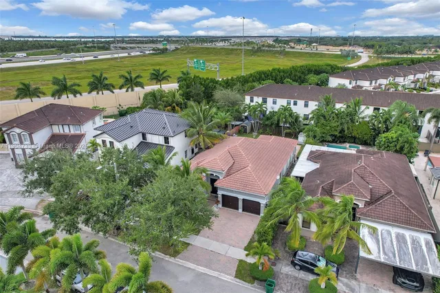an aerial view of a house with a lake view