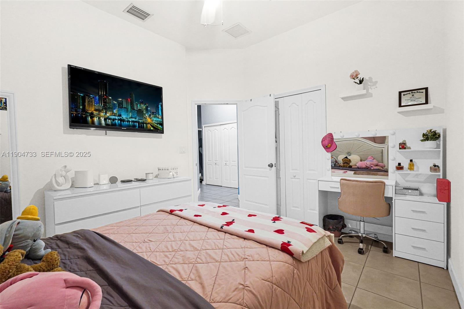 9067 Northwest 182nd Terrace Hialeah, FL 33018 - Photo 23 of 40 a bedroom with a bed and furniture