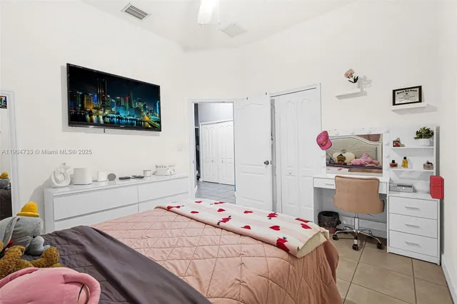 a bedroom with a bed and furniture