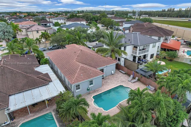 an aerial view of a house with a garden
