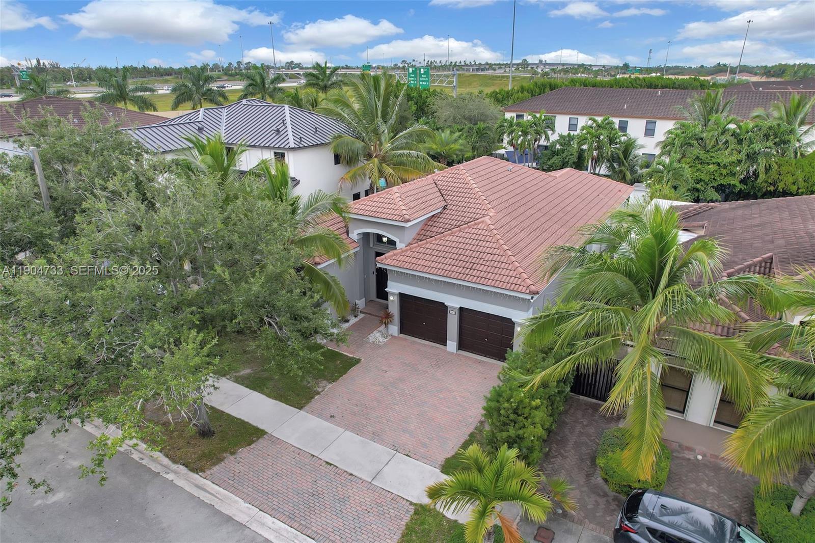 9067 Northwest 182nd Terrace Hialeah, FL 33018 - Photo 37 of 40 an aerial view of house with yard and lake view