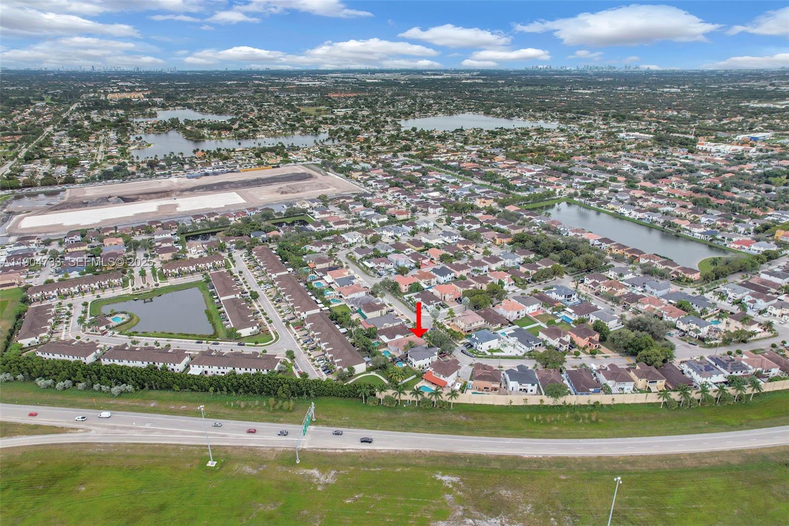 9067 Northwest 182nd Terrace Hialeah, FL 33018 - Photo 40 of 40 an aerial view of residential building with outdoor space and trees