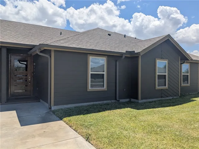 a house view with a garden space