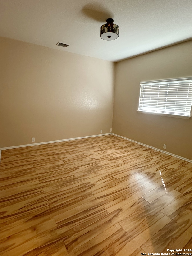 8110 Floating View San Antonio, TX 78255 - Photo 11 of 26 a view of an empty room with a window