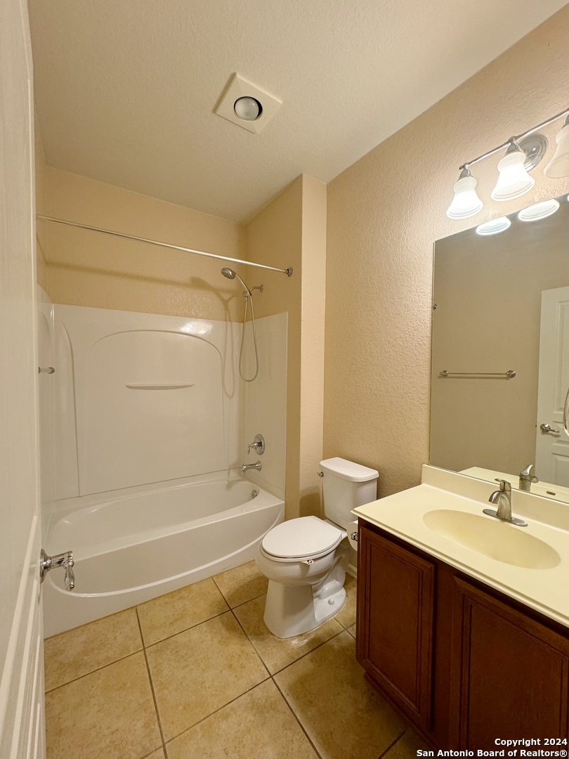 8110 Floating View San Antonio, TX 78255 - Photo 12 of 26 a bathroom with a sink a toilet and shower