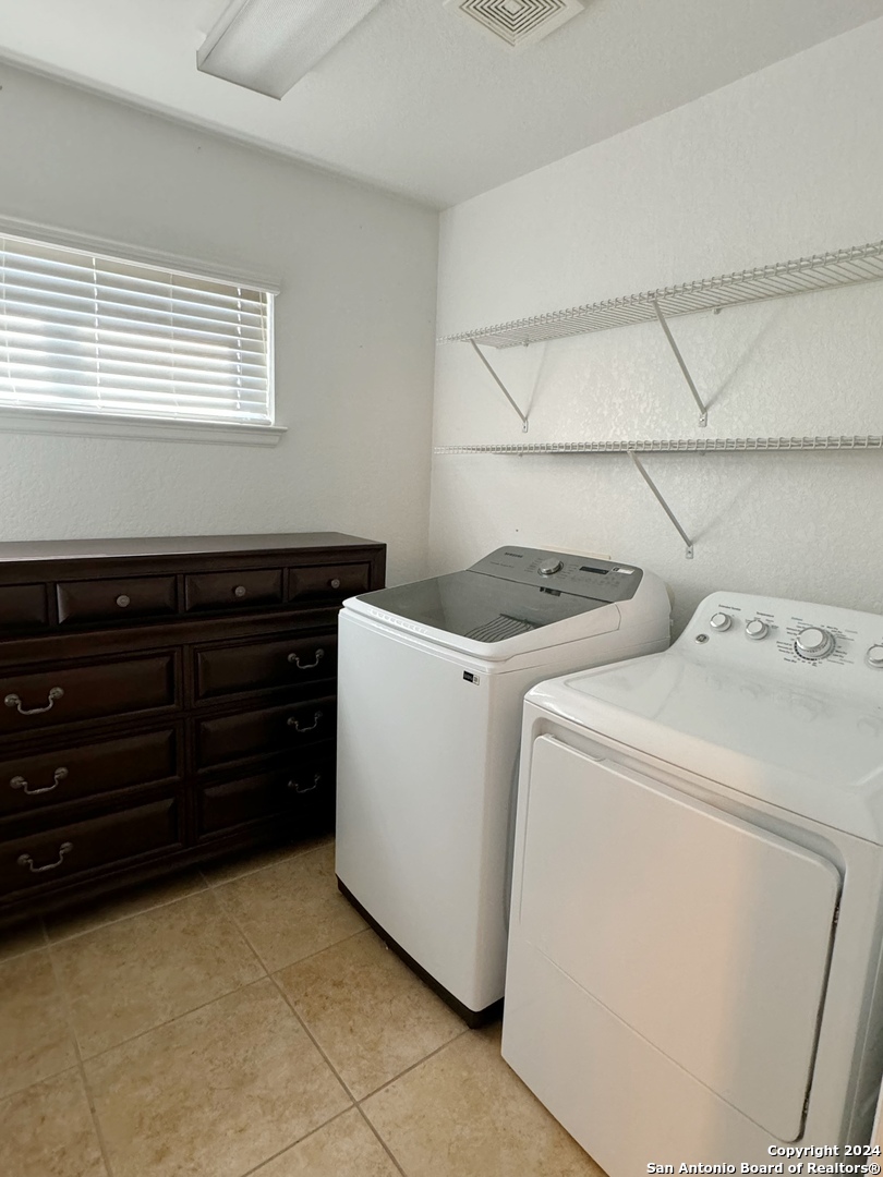 8110 Floating View San Antonio, TX 78255 - Photo 22 of 26 a utility room with dryer and washer