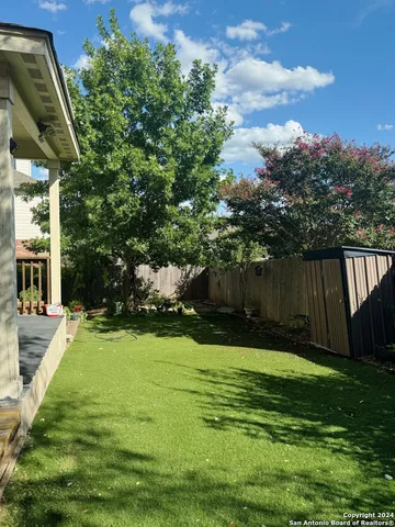 a view of a backyard with green space