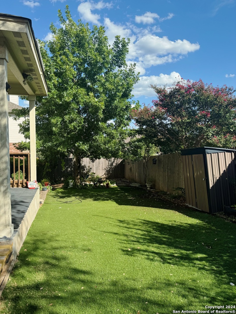 8110 Floating View San Antonio, TX 78255 - Photo 23 of 26 a view of a backyard with green space