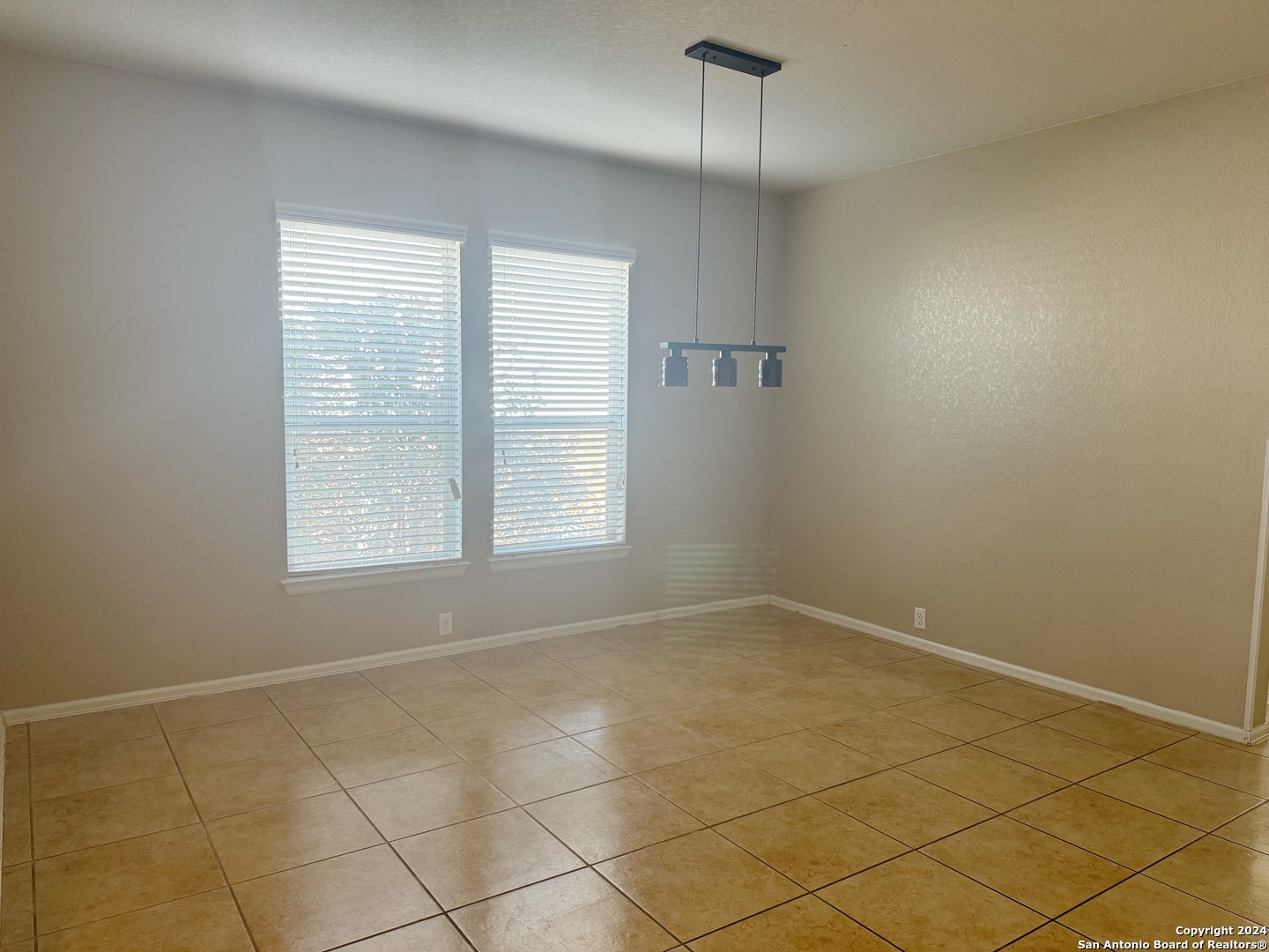8110 Floating View San Antonio, TX 78255 - Photo 9 of 26 an empty room with windows