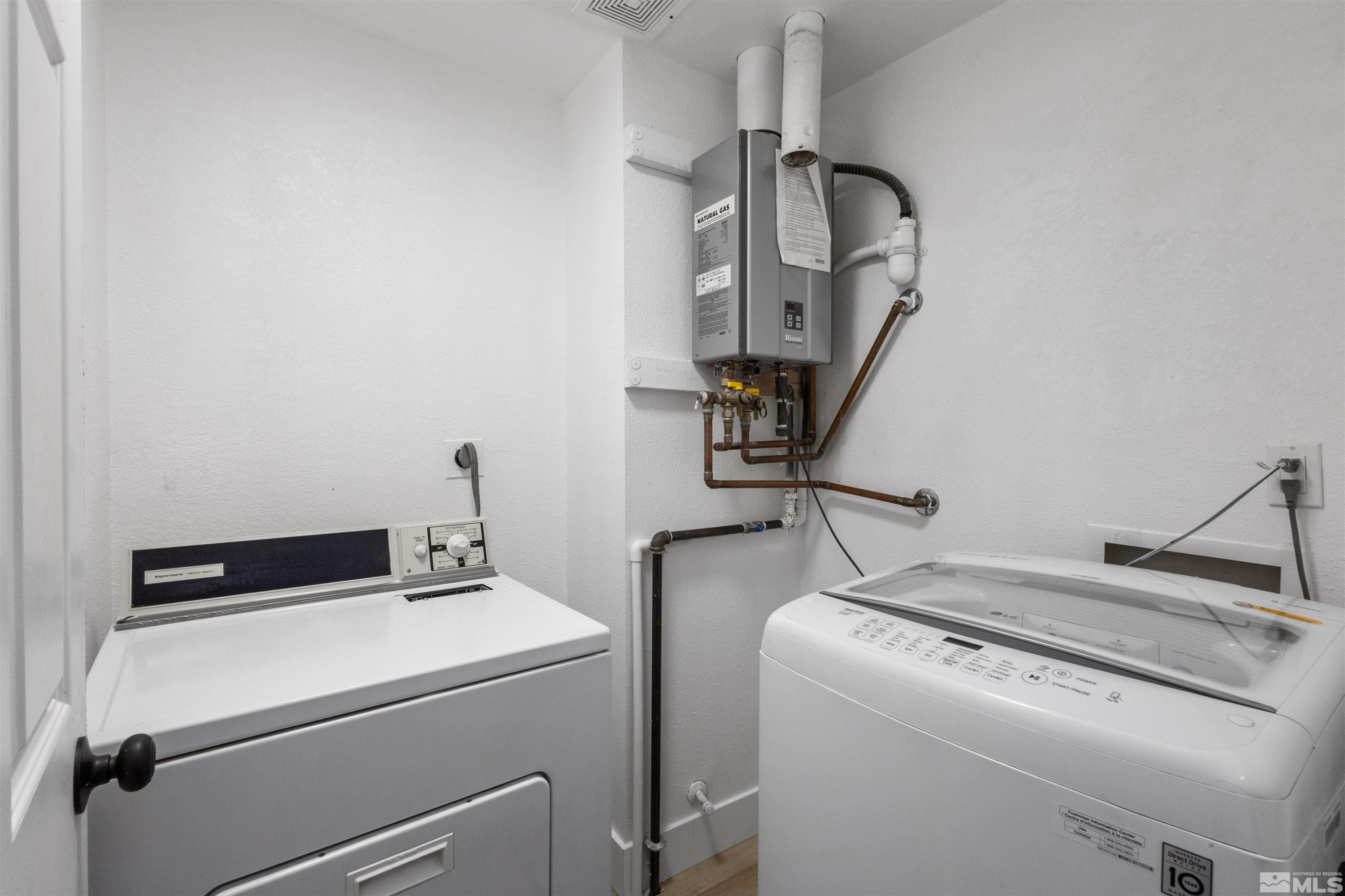6798 Flower Street Reno, NV 89506 - Photo 16 of 22 a utility room with dryer and washer