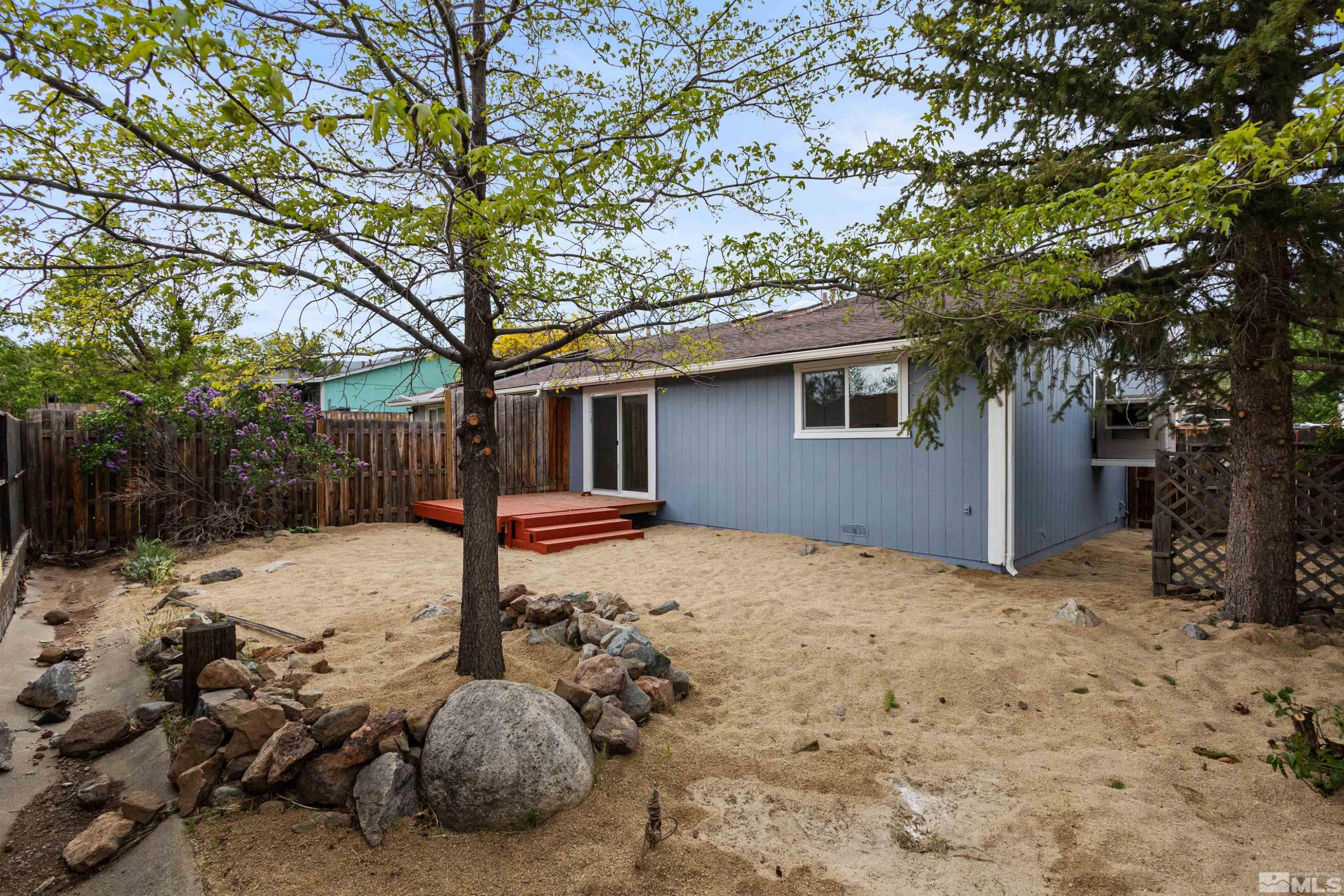 6798 Flower Street Reno, NV 89506 - Photo 17 of 22 a backyard of a house with table and chairs