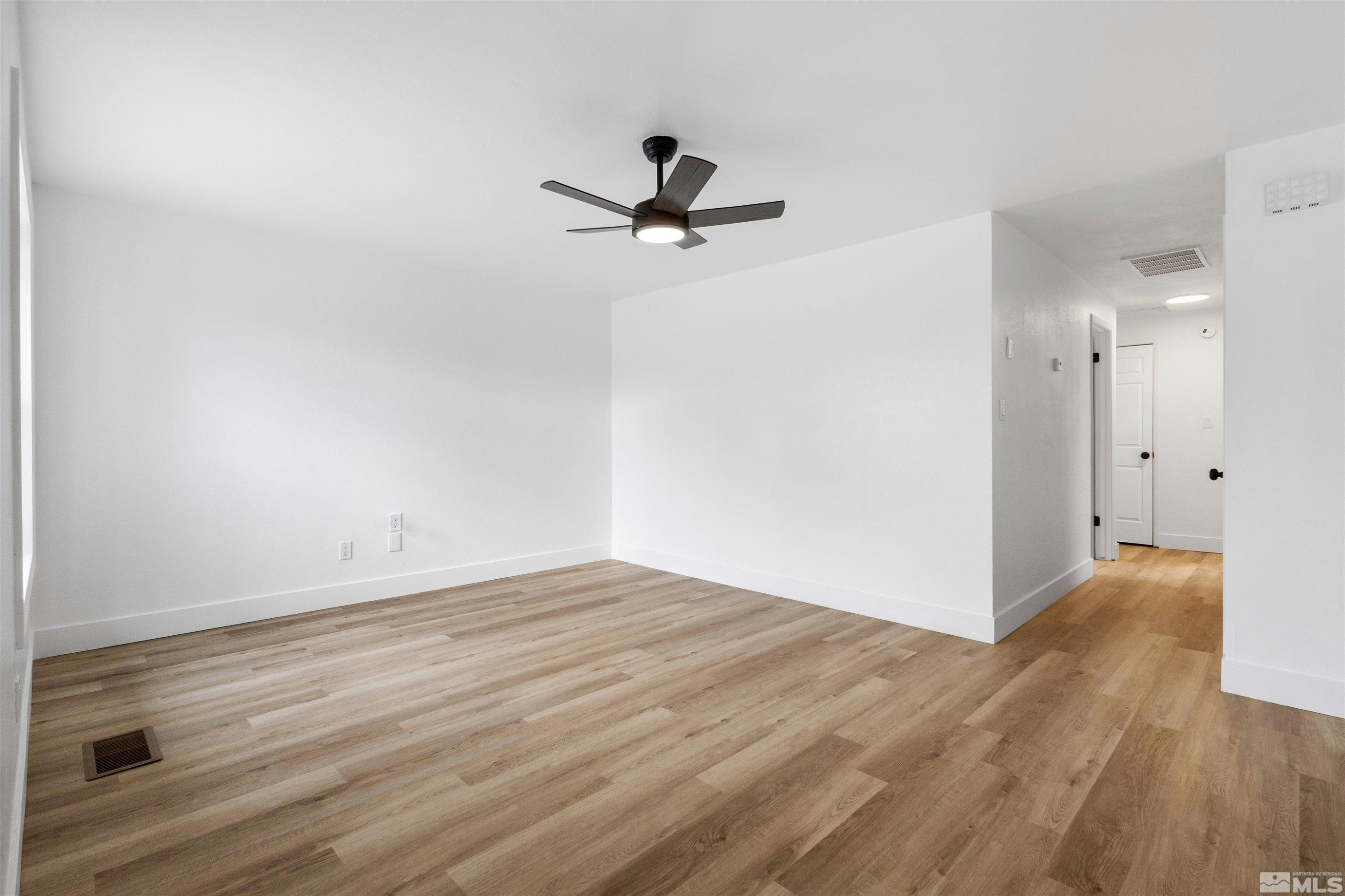6798 Flower Street Reno, NV 89506 - Photo 5 of 22 wooden floor in an empty room