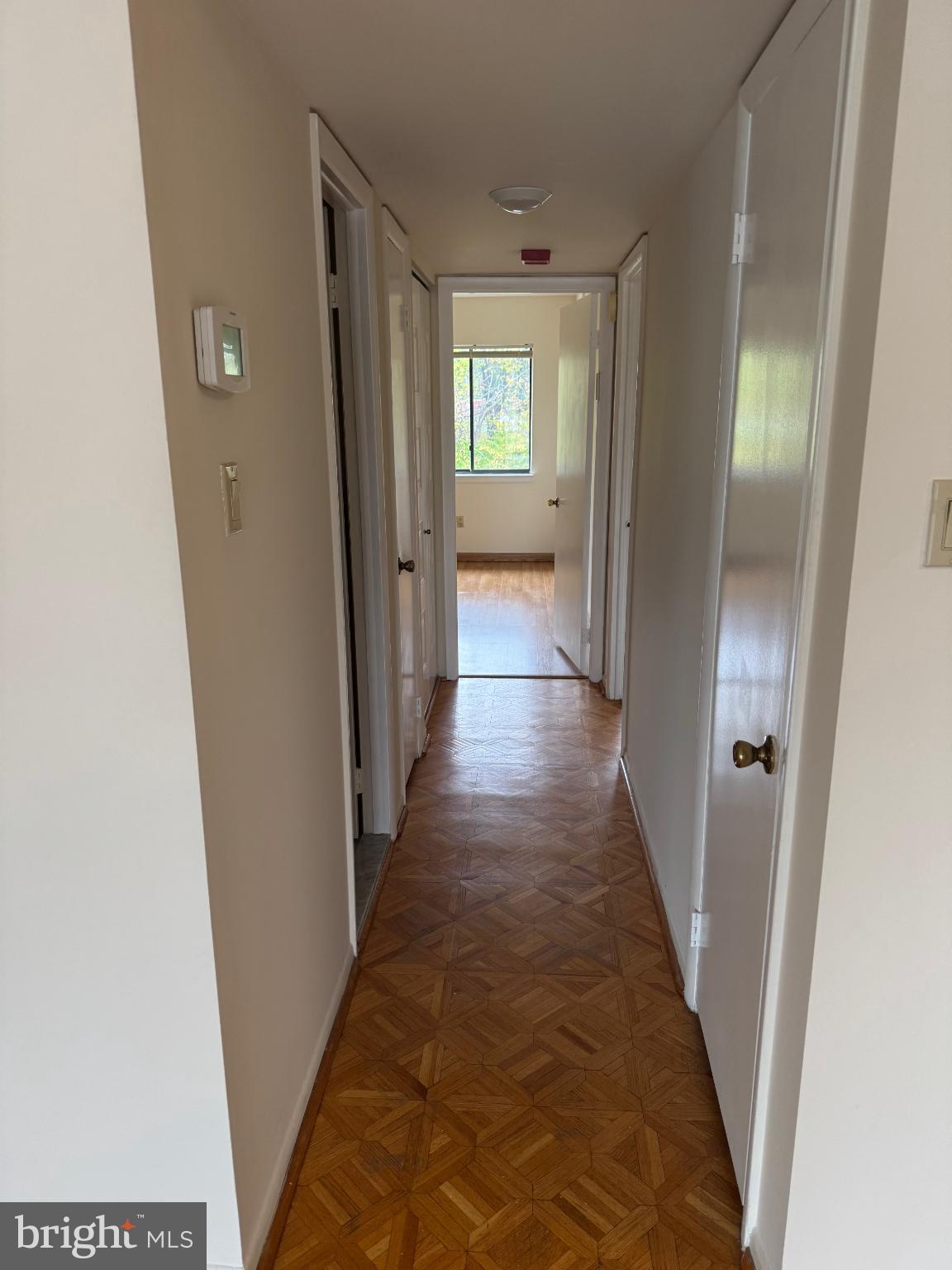 9908-00 Bustleton Avenue, Unit D2 Philadelphia, PA 19115 - Photo 5 of 11 a view of a hallway with wooden floor and closet