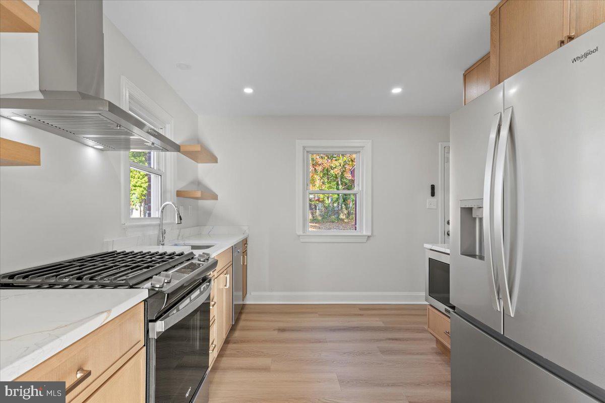 2004 Wolf Street Fort Washington, MD 20744 - Photo 11 of 39 a kitchen with stainless steel appliances granite countertop a refrigerator and a stove top oven