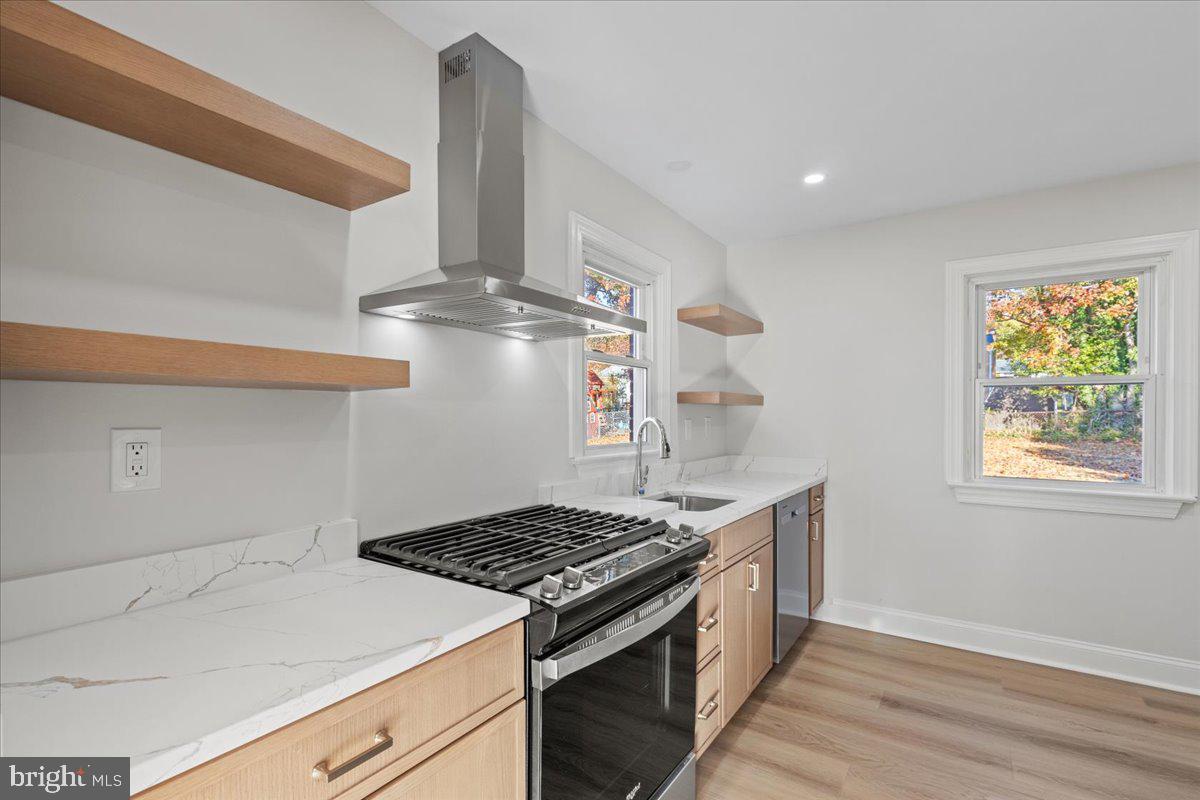 2004 Wolf Street Fort Washington, MD 20744 - Photo 12 of 39 a kitchen with a stove and a window