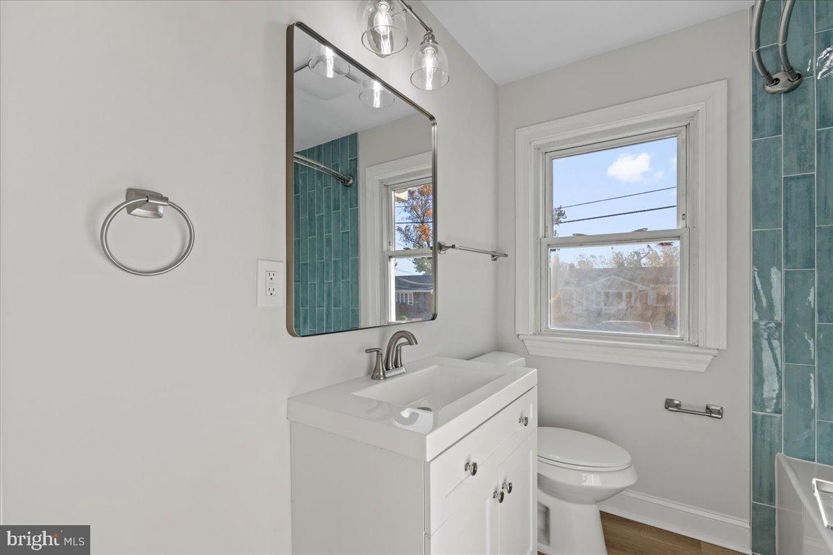 2004 Wolf Street Fort Washington, MD 20744 - Photo 17 of 39 a bathroom with a sink toilet and mirror