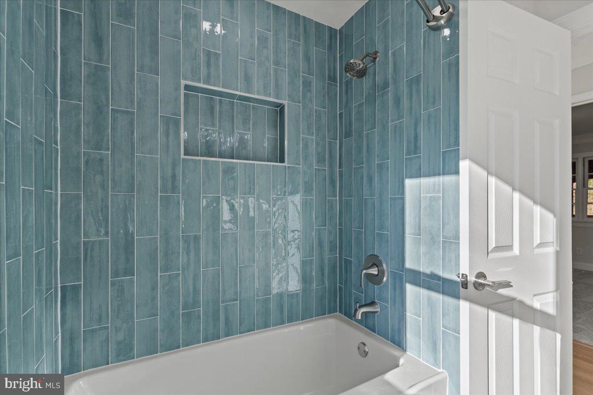 2004 Wolf Street Fort Washington, MD 20744 - Photo 18 of 39 a bathroom with a bathtub and shower