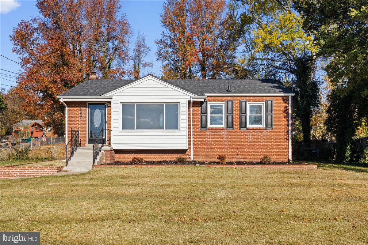 2004 Wolf Street Fort Washington, MD 20744 - Photo 2 of 39 a front view of a house with a yard
