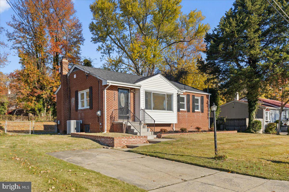 2004 Wolf Street Fort Washington, MD 20744 - Photo 4 of 39 a front view of a house with a yard