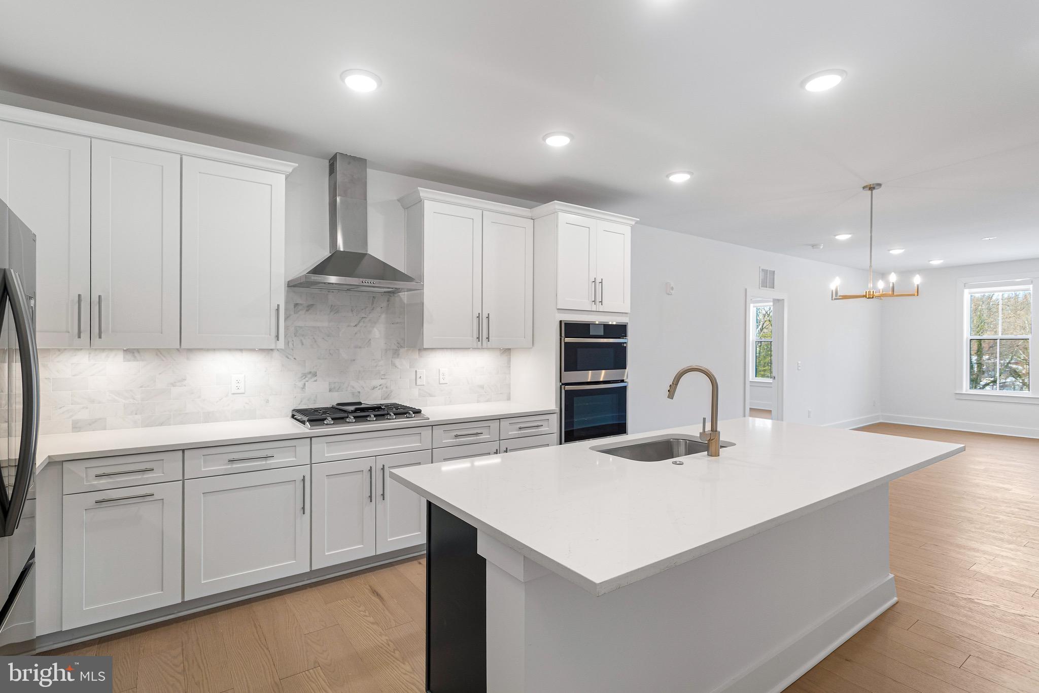 76 Old Mill Bottom Road North, Unit 205 Annapolis, MD 21409 - Photo 17 of 34 a kitchen with kitchen island a sink stainless steel appliances and cabinets