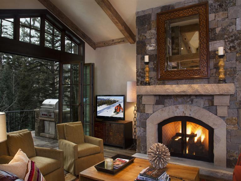 405 West Forest Road Vail, CO 81657 - Photo 5 of 22 a living room with furniture and a fireplace