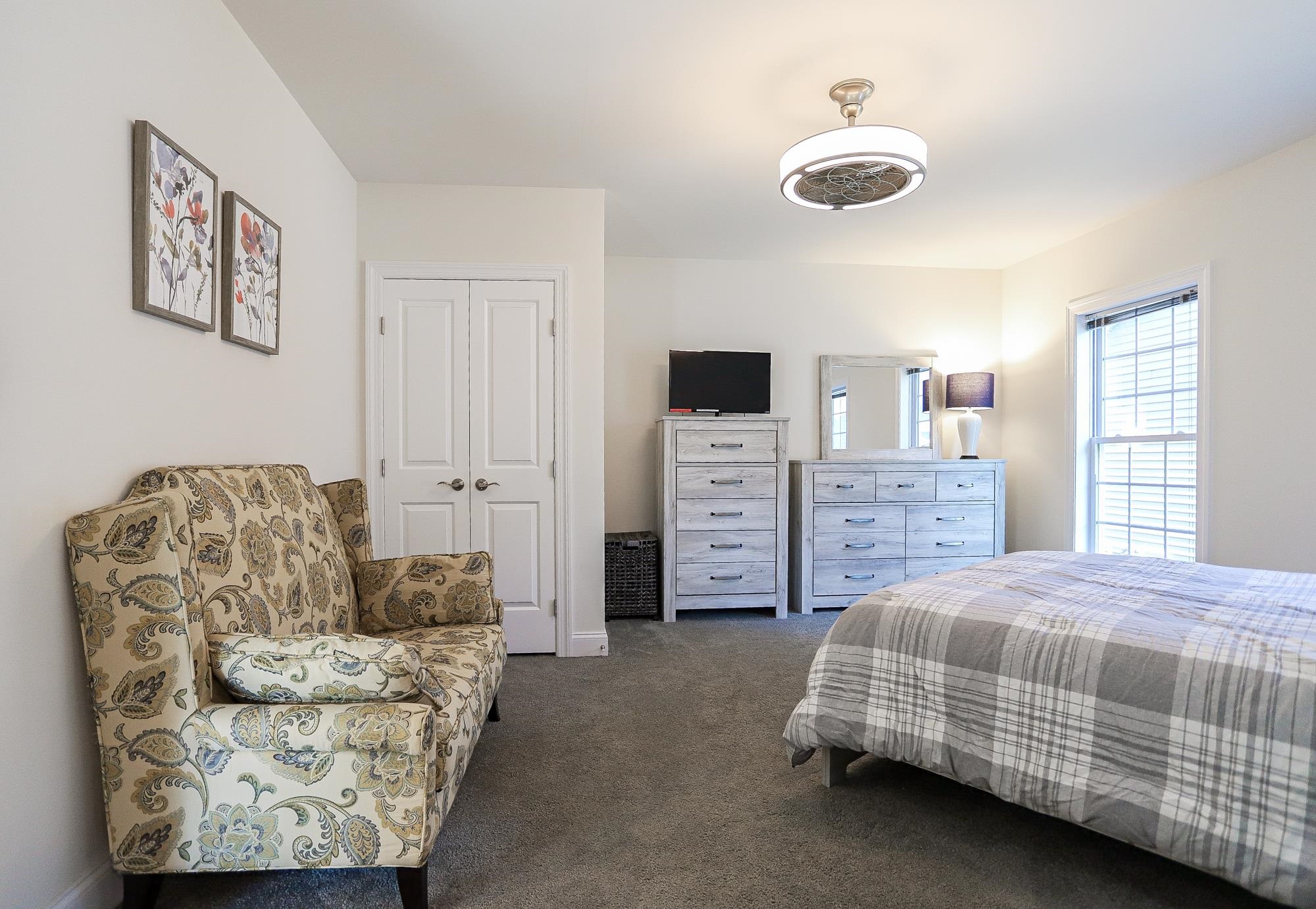 18 Cedarbrook Road Cape May, NJ 08204 - Photo 12 of 44 a bedroom with a bed and ceiling fan