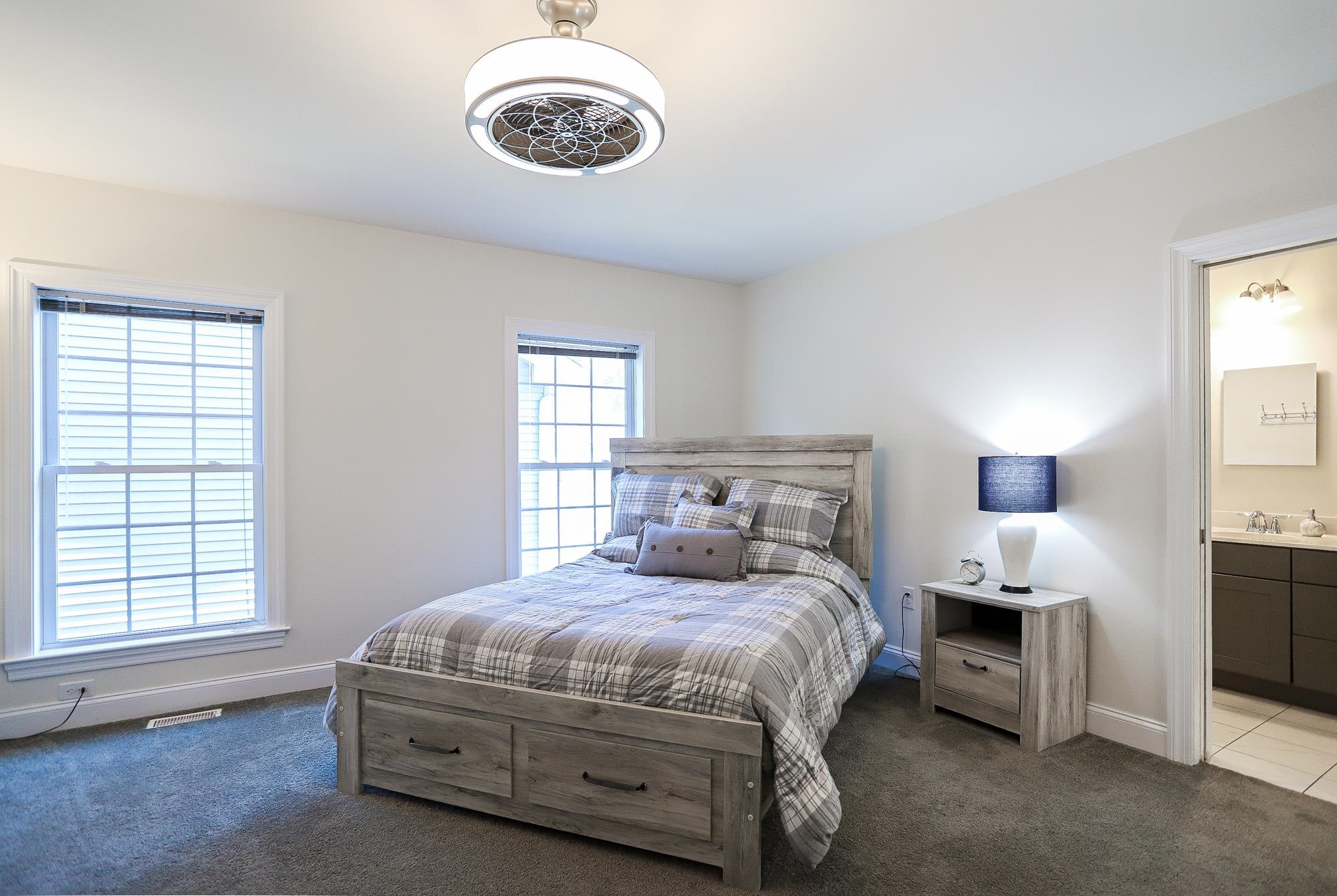 18 Cedarbrook Road Cape May, NJ 08204 - Photo 13 of 44 a bedroom with a bed and a window