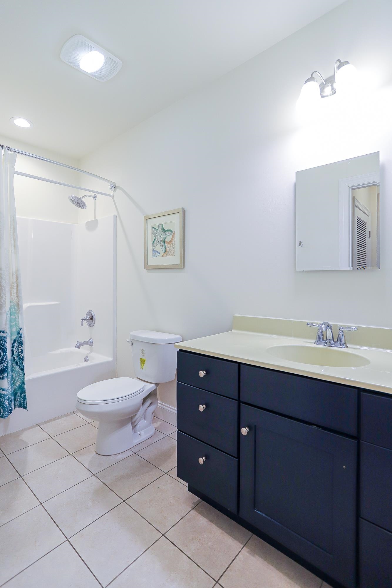 18 Cedarbrook Road Cape May, NJ 08204 - Photo 14 of 44 a bathroom with a toilet a sink and mirror