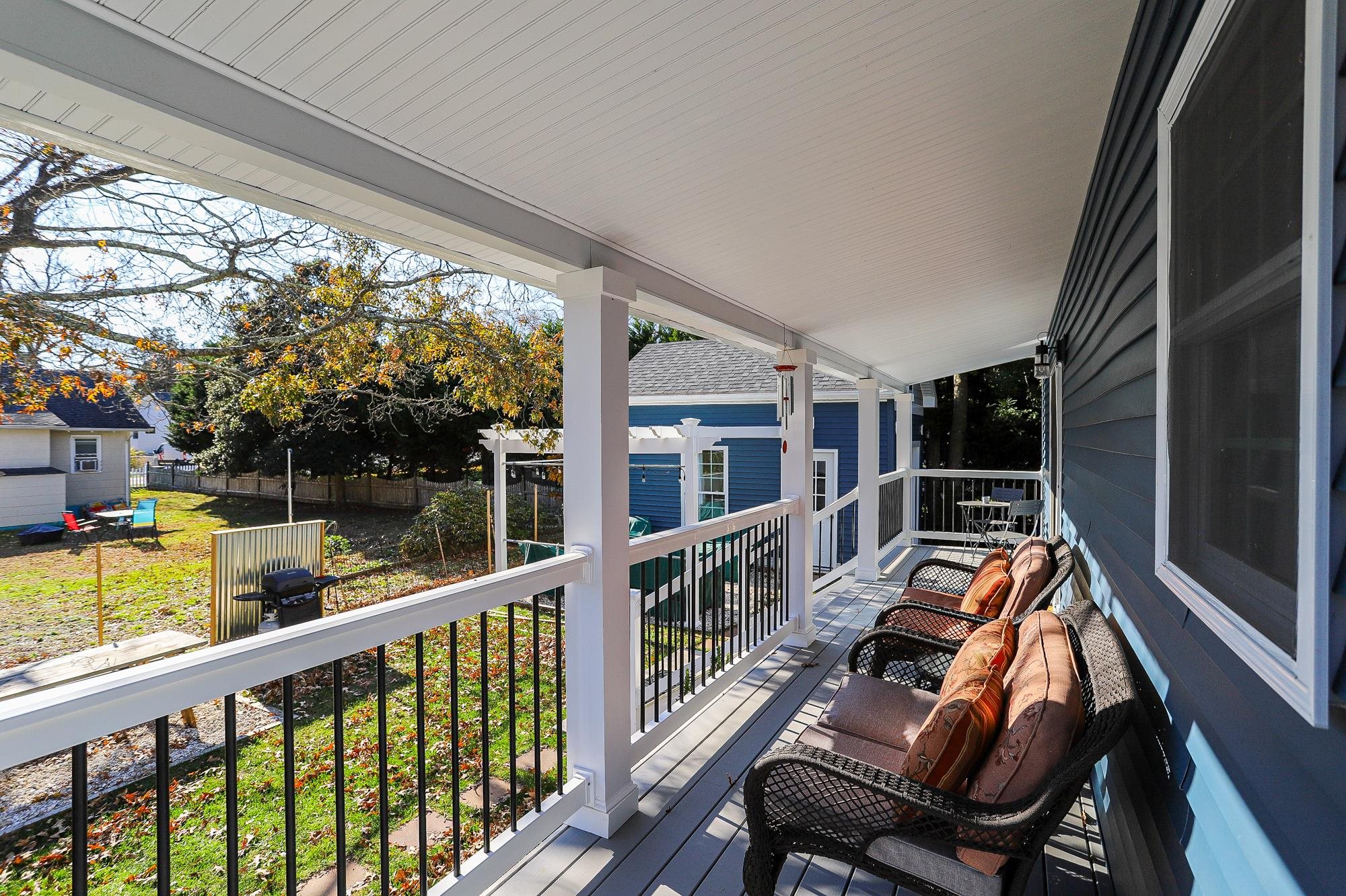 18 Cedarbrook Road Cape May, NJ 08204 - Photo 30 of 44 a view of deck with chairs and wooden floor