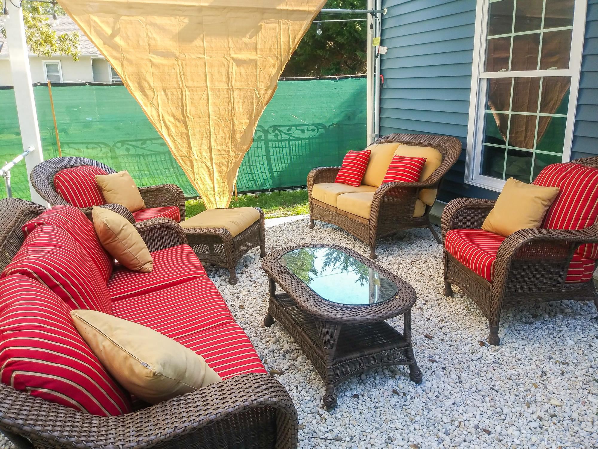 18 Cedarbrook Road Cape May, NJ 08204 - Photo 33 of 44 a view of a backyard with couches table and chairs and potted plants