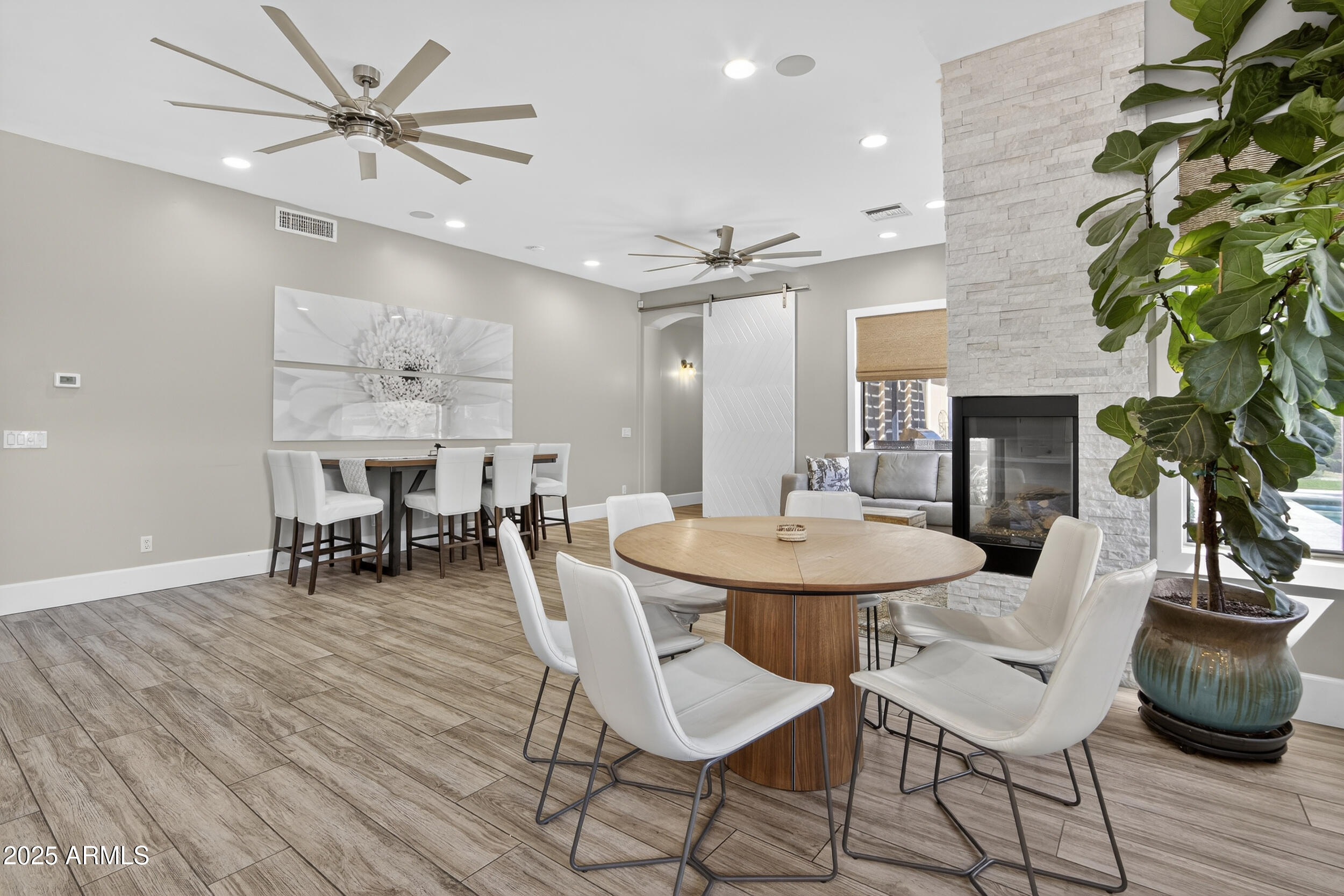 1333 North Cliffside Drive Gilbert, AZ 85234 - Photo 13 of 100 a view of a dining room with furniture and wooden floor