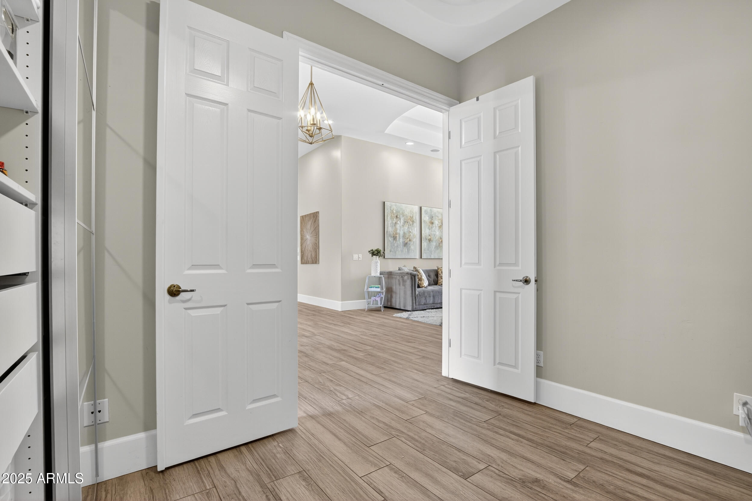 1333 North Cliffside Drive Gilbert, AZ 85234 - Photo 16 of 100 a view of a hallway with wooden floor and closet area