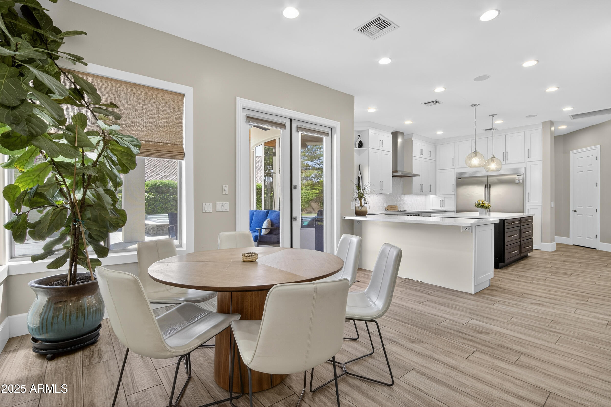 1333 North Cliffside Drive Gilbert, AZ 85234 - Photo 18 of 100 a dining room with furniture and wooden floor