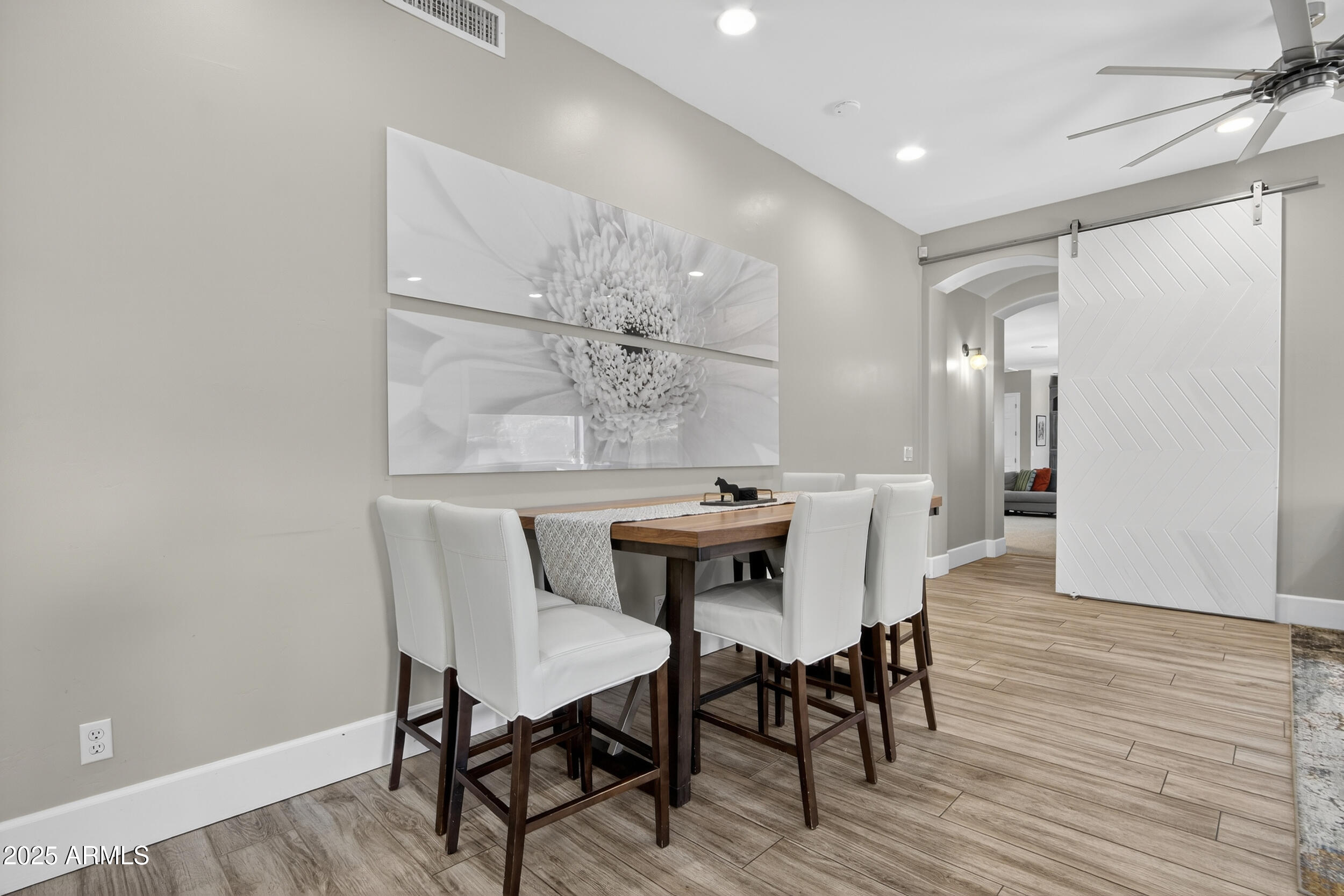 1333 North Cliffside Drive Gilbert, AZ 85234 - Photo 29 of 100 a view of a dining room with furniture and wooden floor