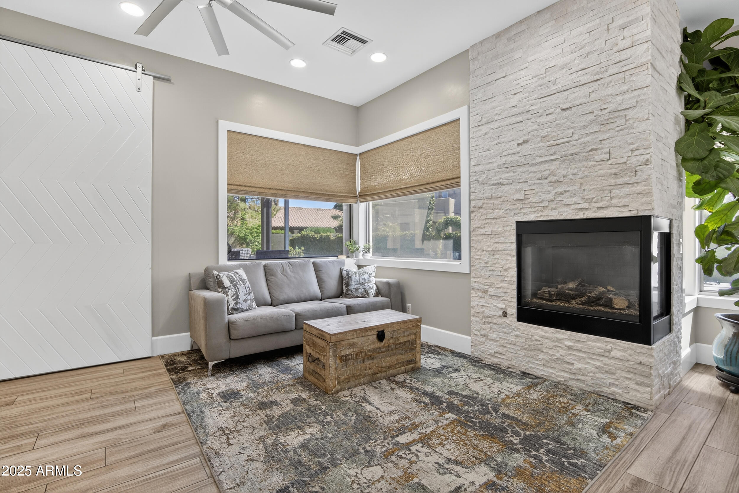 1333 North Cliffside Drive Gilbert, AZ 85234 - Photo 30 of 100 a living room with furniture and a fireplace