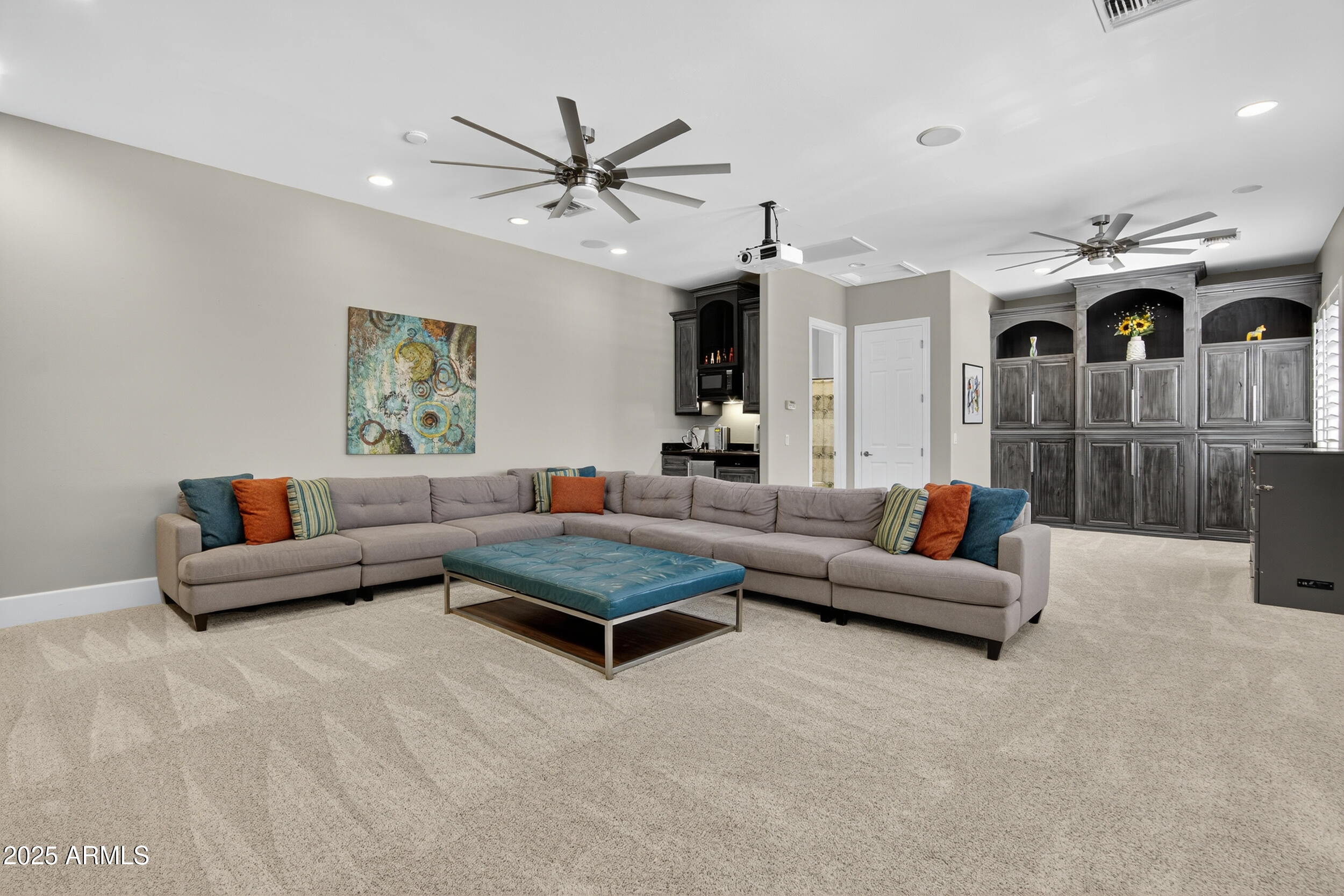 1333 North Cliffside Drive Gilbert, AZ 85234 - Photo 37 of 100 a living room with furniture and a chandelier