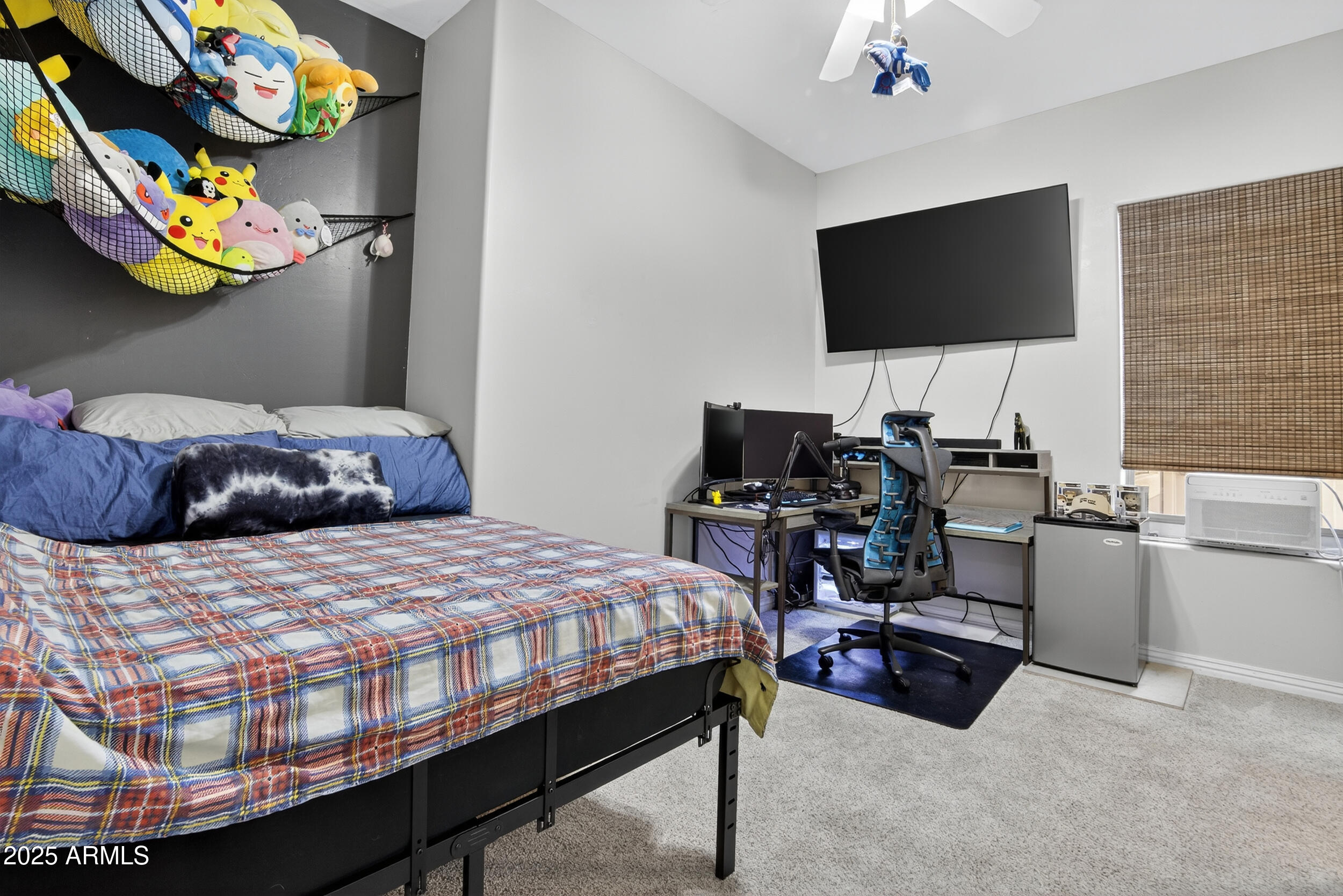 1333 North Cliffside Drive Gilbert, AZ 85234 - Photo 55 of 100 a bedroom with a bed and a flat screen tv