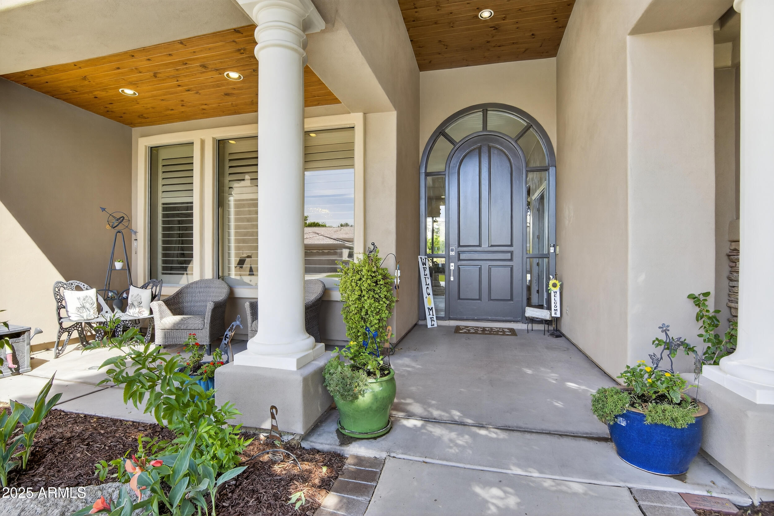 1333 North Cliffside Drive Gilbert, AZ 85234 - Photo 4 of 100 a front view of a house with lots of potted plants