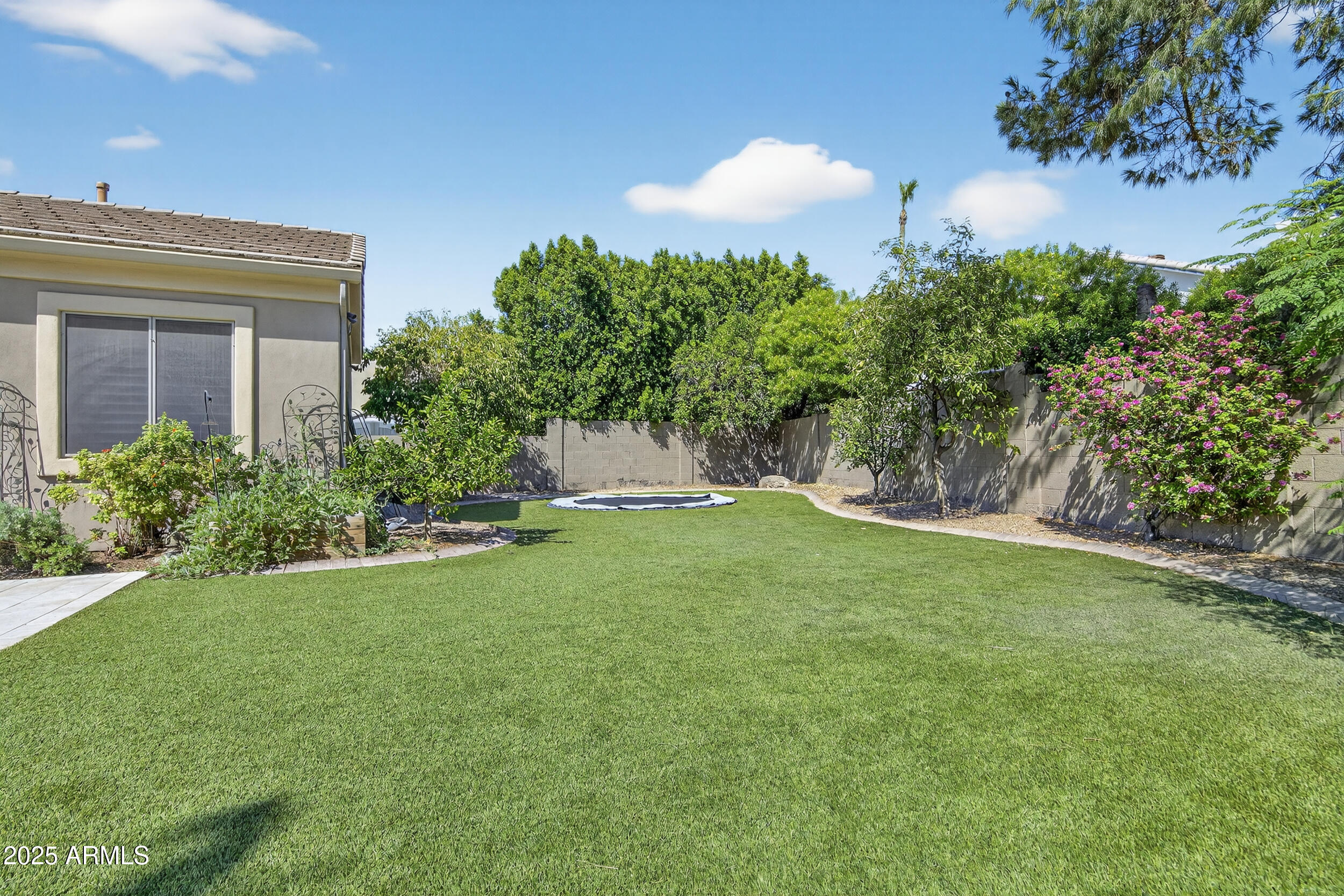 1333 North Cliffside Drive Gilbert, AZ 85234 - Photo 72 of 100 a view of a house with a backyard and a garden