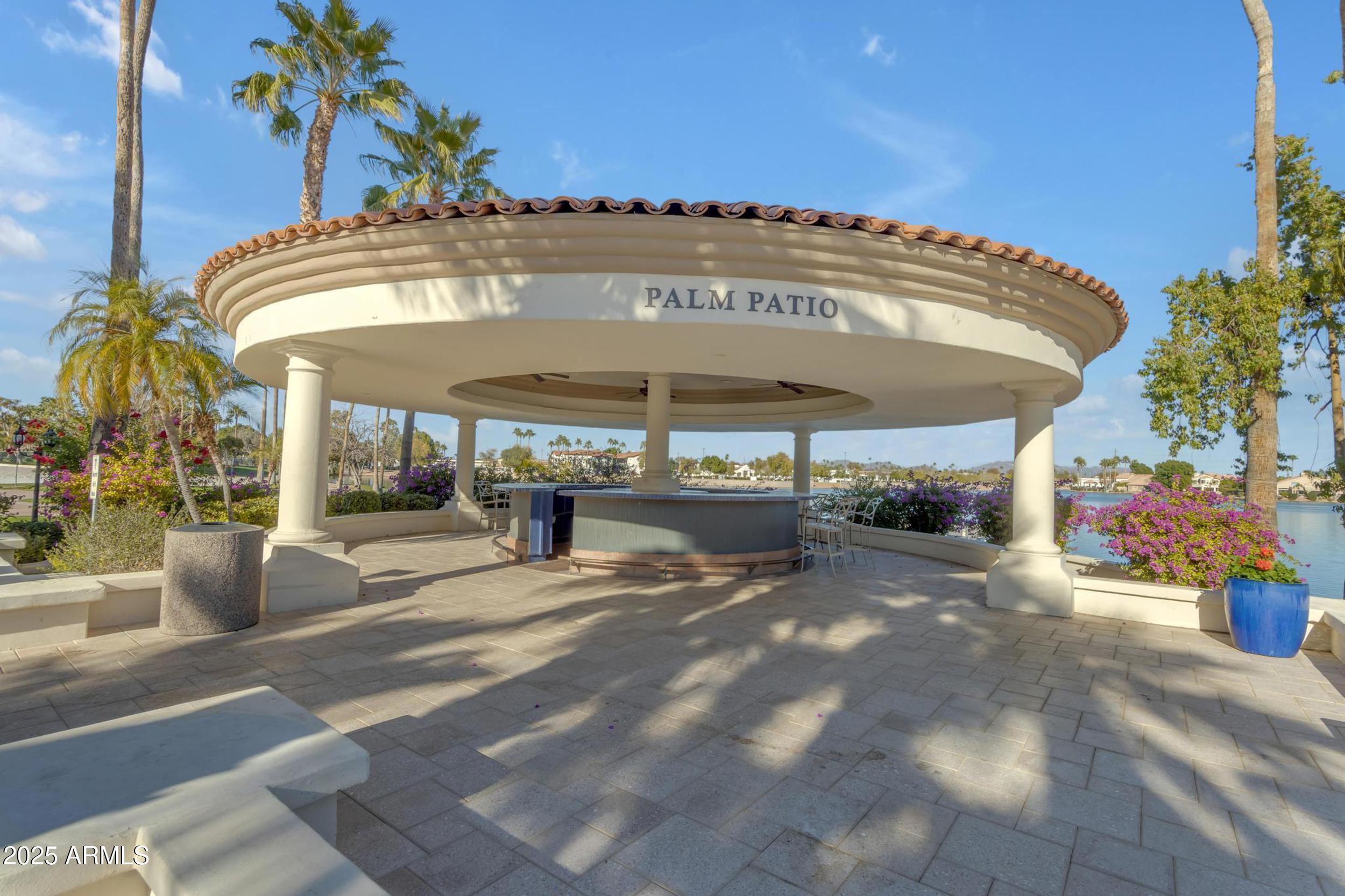 1333 North Cliffside Drive Gilbert, AZ 85234 - Photo 90 of 100 a view of a patio with a table and chairs under an umbrella