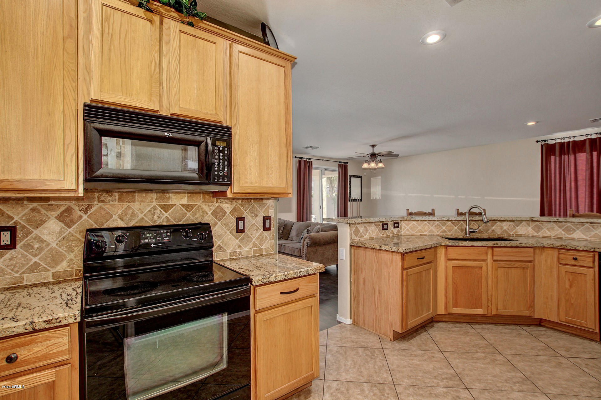 2010 West Carson Road Phoenix, AZ 85041 - Photo 10 of 12 a kitchen with stainless steel appliances a stove sink and microwave