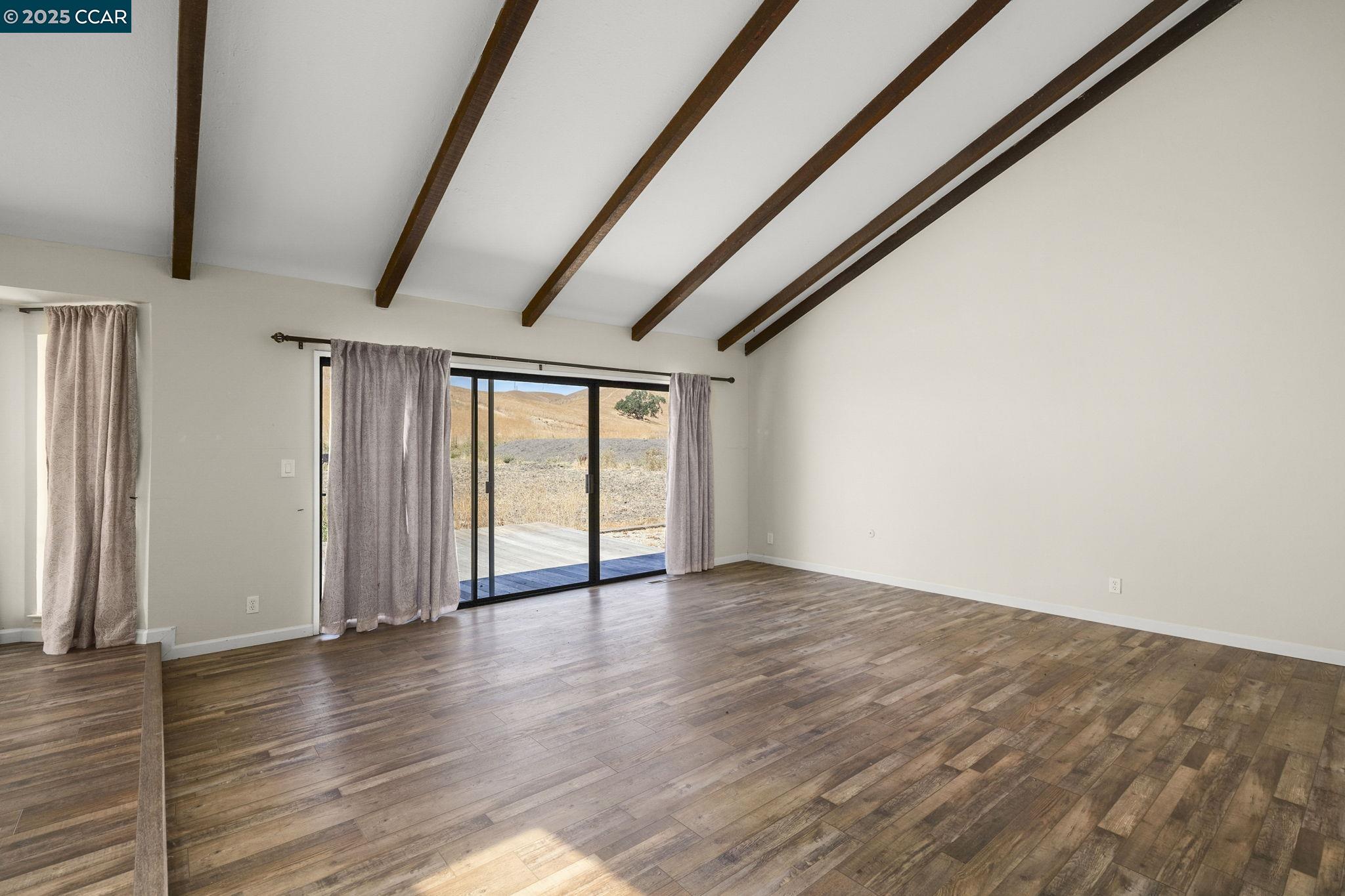 1610 Lawrence Road Danville, CA 94506 - Photo 14 of 36 a view of an empty room with wooden floor and a window