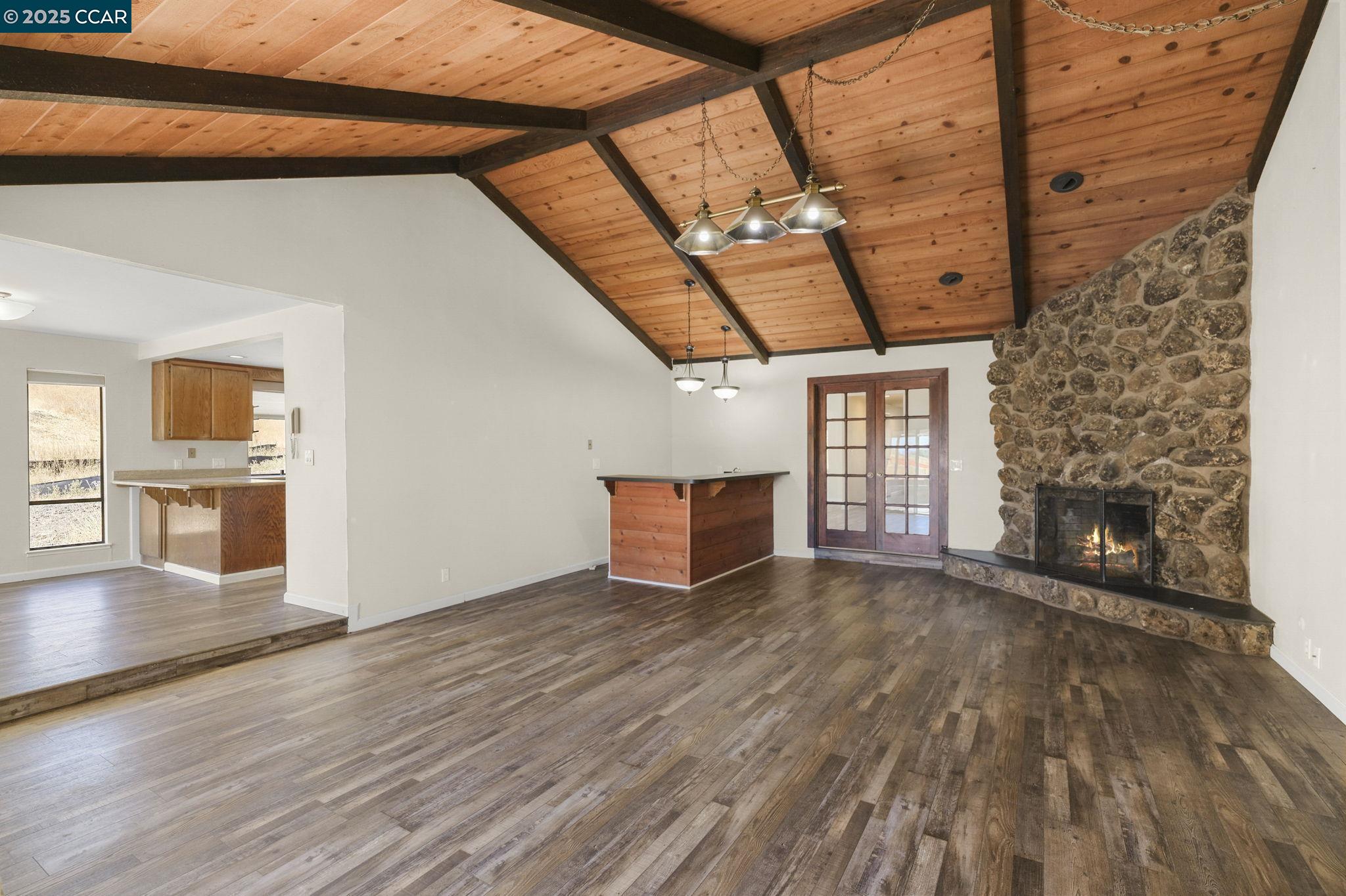 1610 Lawrence Road Danville, CA 94506 - Photo 17 of 36 a view of an empty room with wooden floor and a fireplace