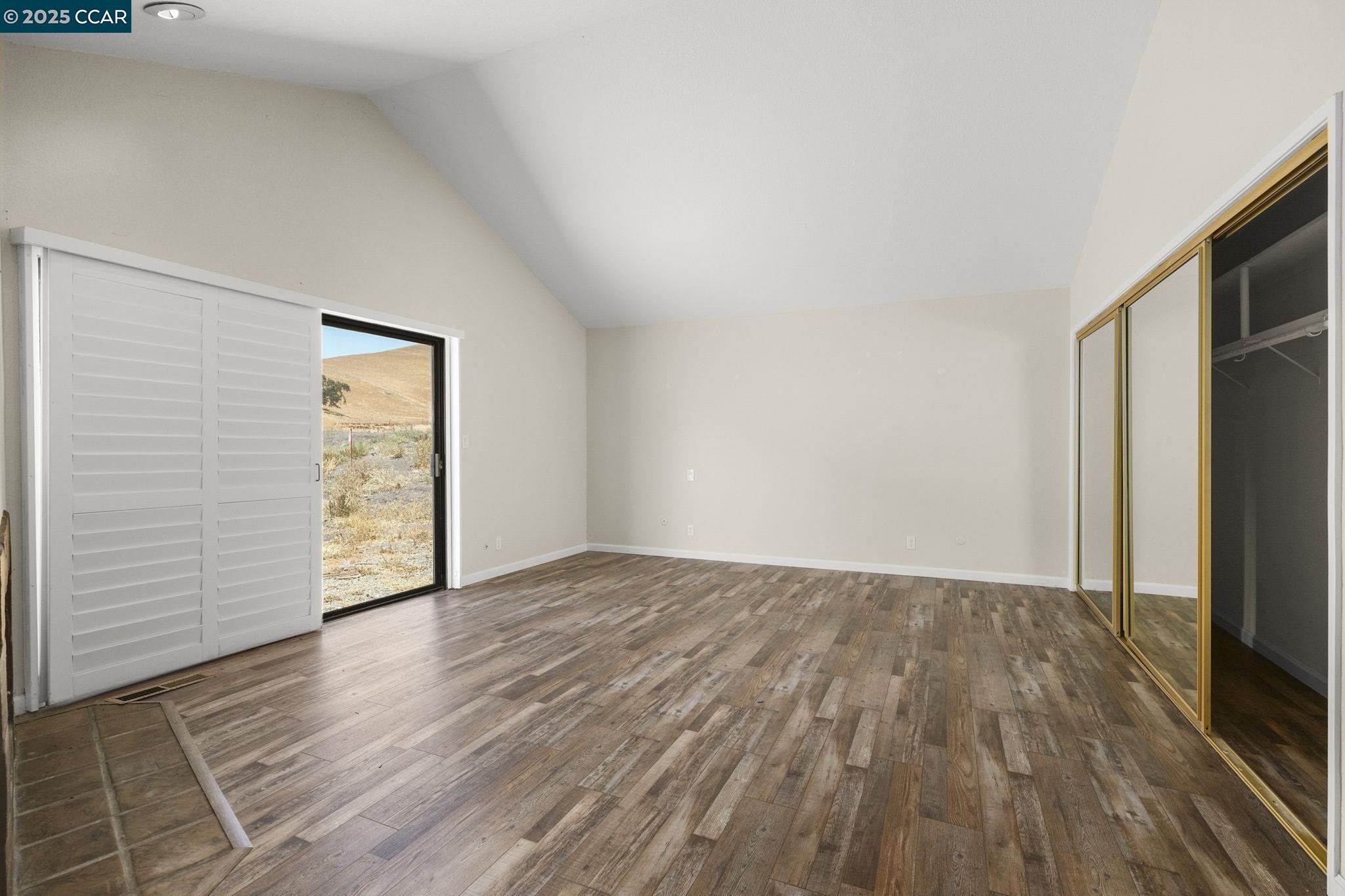 1610 Lawrence Road Danville, CA 94506 - Photo 22 of 36 a view of an empty room with wooden floor and a window